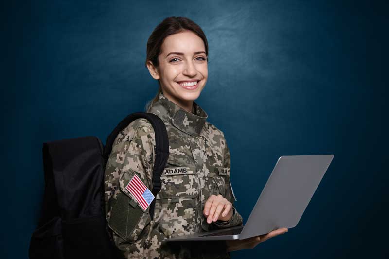 Female cadet with backpack and laptop